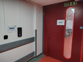 Red door in hospital showing Pathology entrance