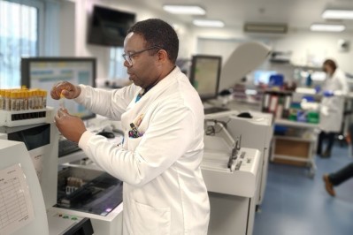 Male scientist in uniform working at a desk